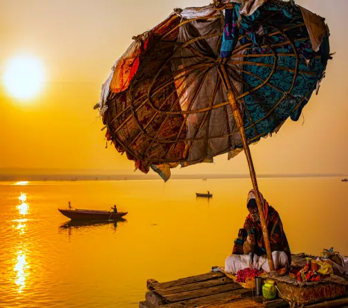 Sadhu sitting by the Ganges River in Varanasi